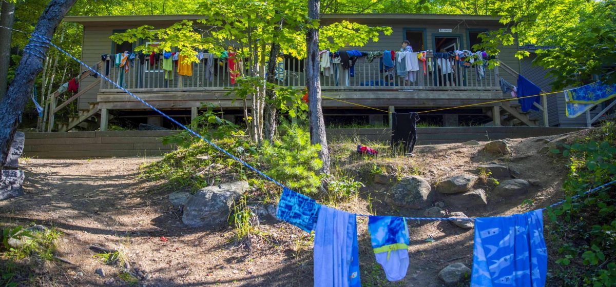 Clothes hanging to dry outside camp building.